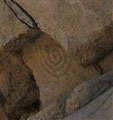 Rock door with the sun sign