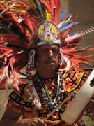 Native American dancer with a drum